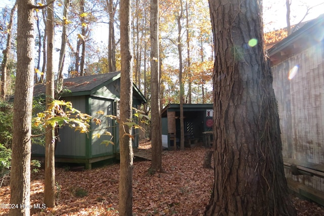 view of property exterior featuring a shed