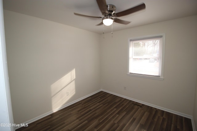 unfurnished room with dark wood-type flooring and ceiling fan