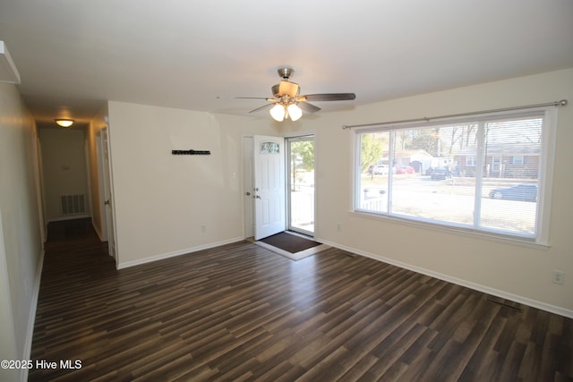 interior space with dark hardwood / wood-style floors and ceiling fan