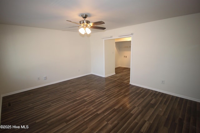 unfurnished room featuring ceiling fan and dark hardwood / wood-style flooring