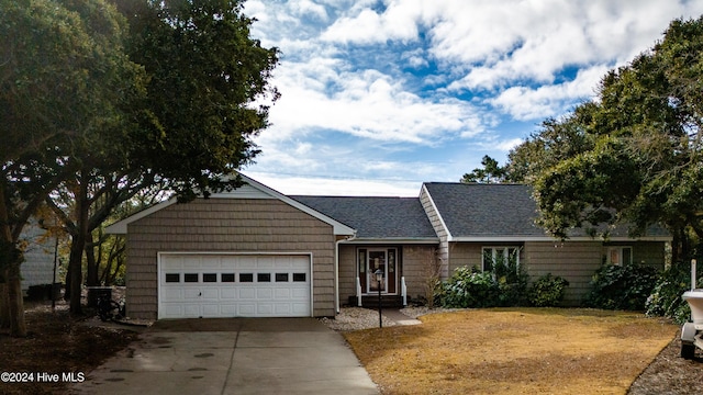 ranch-style house featuring a garage