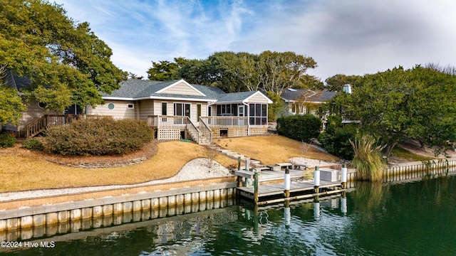 exterior space with a deck with water view