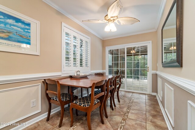 dining room with light tile patterned floors, crown molding, ceiling fan, and a healthy amount of sunlight