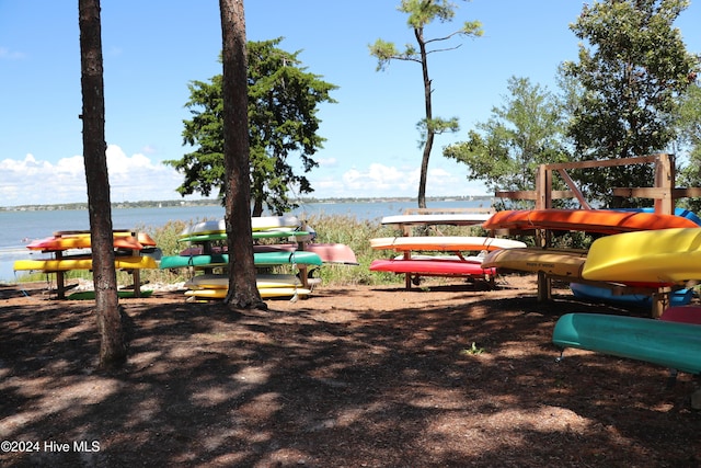 view of playground with a water view