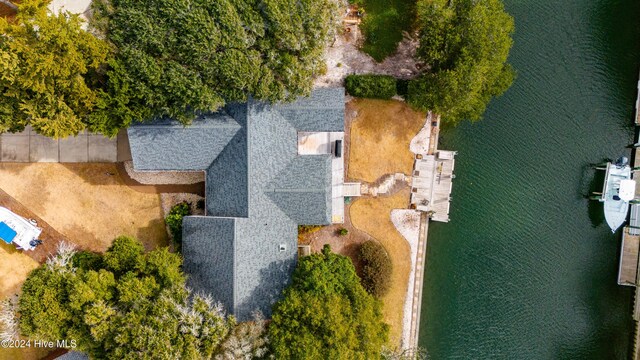 birds eye view of property featuring a water view