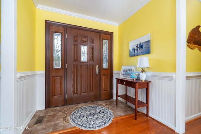 foyer featuring hardwood / wood-style floors and ornamental molding