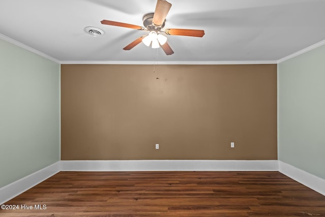 empty room featuring ceiling fan, dark hardwood / wood-style flooring, and ornamental molding