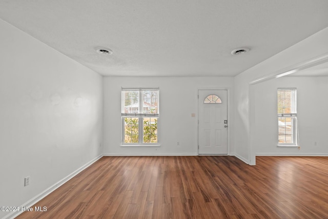 foyer entrance featuring dark hardwood / wood-style floors