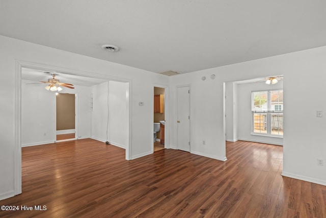 empty room featuring dark hardwood / wood-style floors and ceiling fan