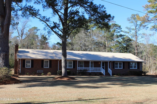 ranch-style house with covered porch