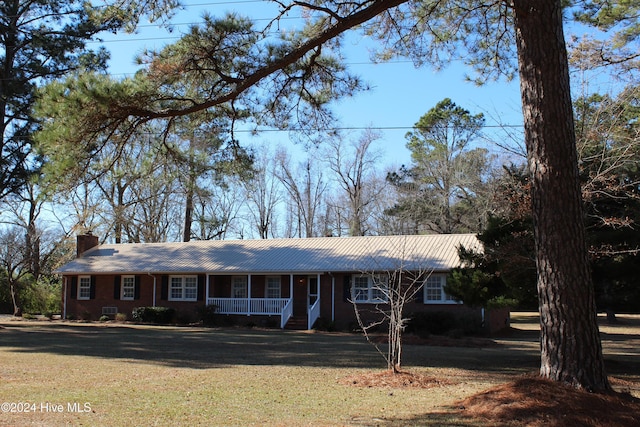 ranch-style home featuring a front yard and a porch