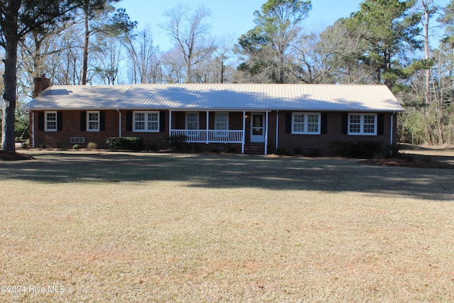 single story home featuring a porch and a front yard