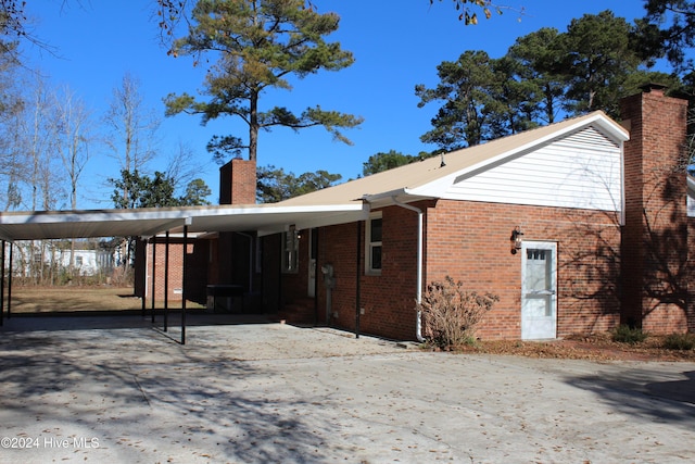 view of front facade with a carport