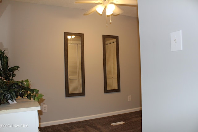 carpeted empty room with ceiling fan and a textured ceiling