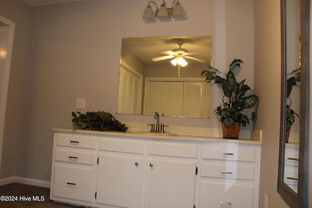 bathroom with ceiling fan and vanity