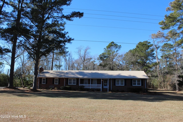 single story home with a front yard and a porch