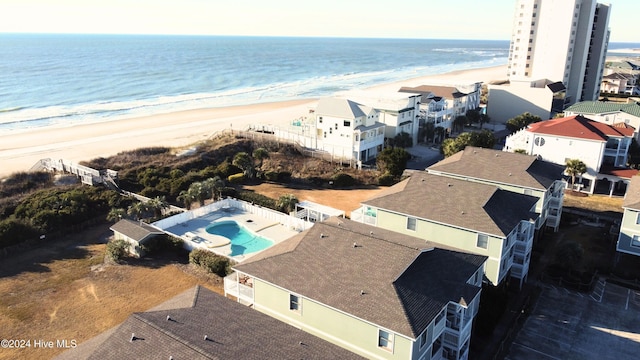 aerial view featuring a water view and a beach view