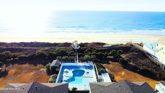 view of pool with a water view