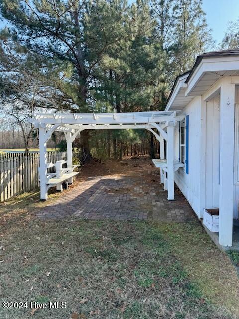 view of yard with a pergola and a patio area