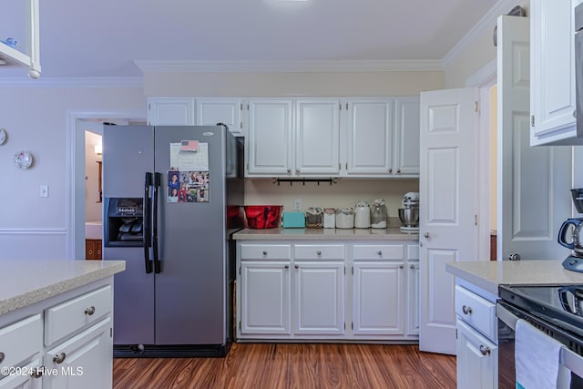 kitchen featuring white cabinetry, stainless steel fridge, dark hardwood / wood-style floors, and ornamental molding