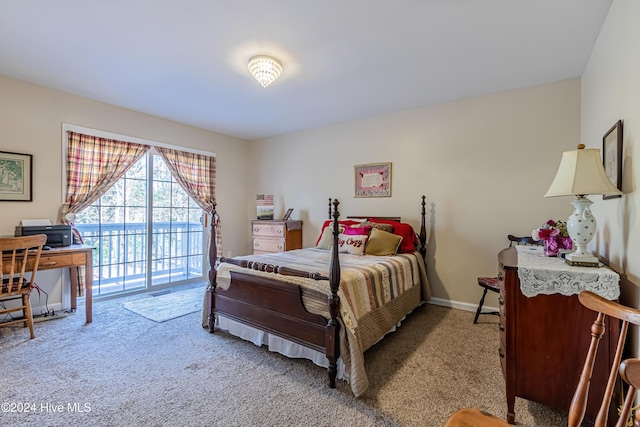 bedroom with access to exterior and light colored carpet