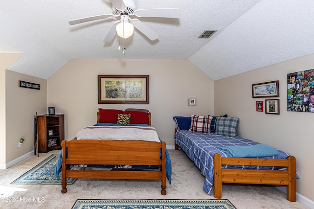 bedroom featuring a textured ceiling, light colored carpet, ceiling fan, and lofted ceiling