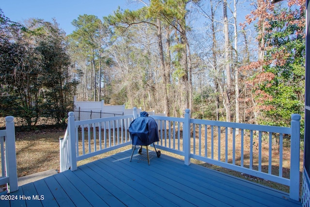 wooden terrace featuring area for grilling