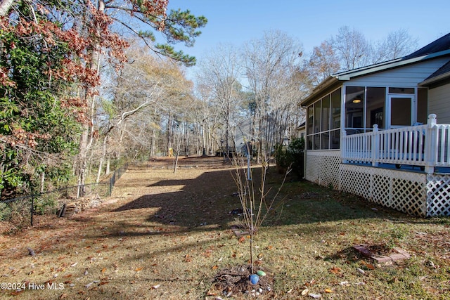 view of yard with a sunroom