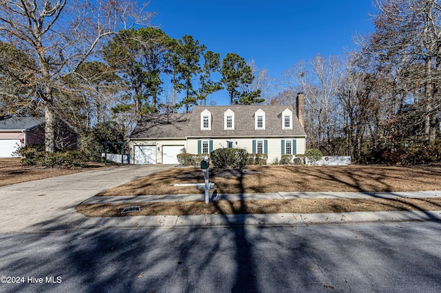 cape cod house with a garage