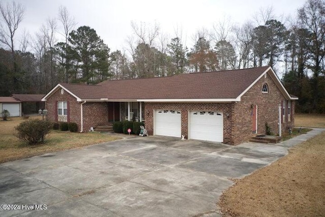 ranch-style home featuring a garage