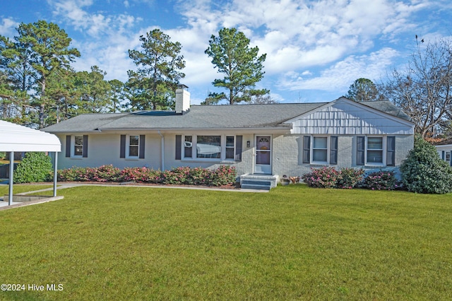 ranch-style home with a front lawn