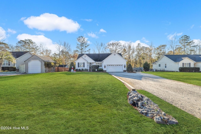 single story home featuring a front yard and a garage