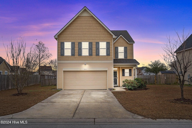 front of property with a garage