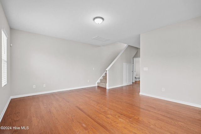 interior space with plenty of natural light and hardwood / wood-style floors