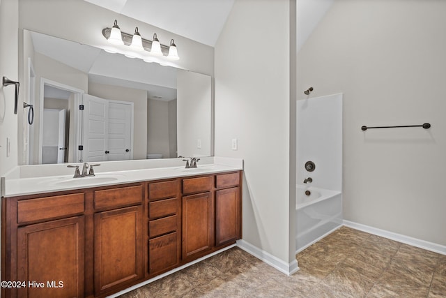 full bathroom featuring vanity, vaulted ceiling, toilet, and shower / bath combination