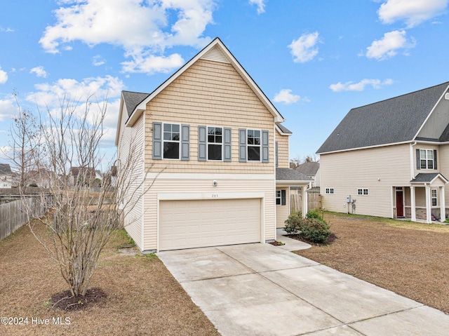 view of front property with a garage and a front lawn