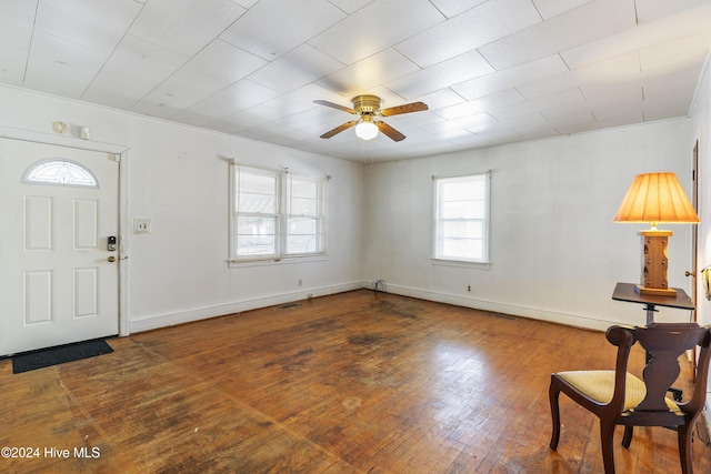 foyer with ceiling fan and dark hardwood / wood-style flooring