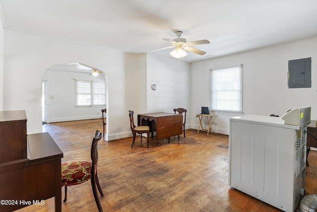 laundry room with washer / clothes dryer, a wealth of natural light, electric panel, and hardwood / wood-style flooring