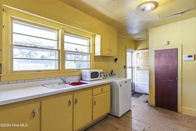 kitchen with washer / dryer and sink