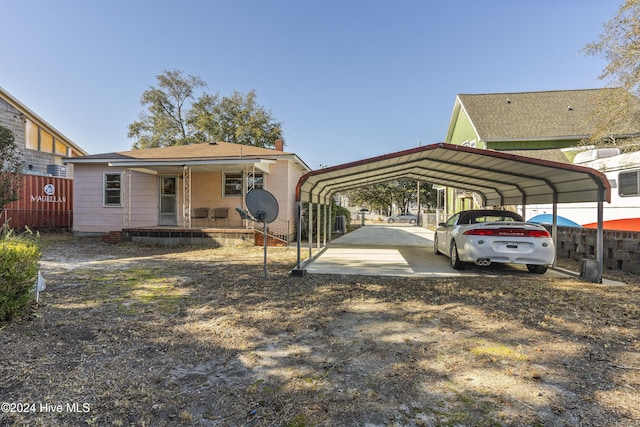 exterior space featuring covered porch and a carport