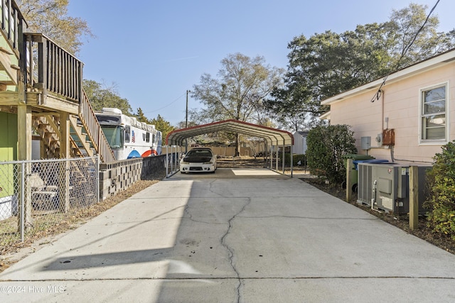 view of parking / parking lot featuring a carport