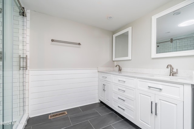 bathroom featuring tile patterned floors, vanity, and an enclosed shower