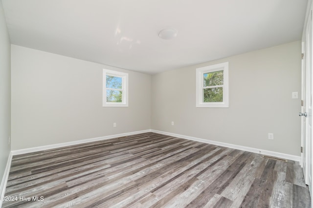 unfurnished room featuring wood-type flooring