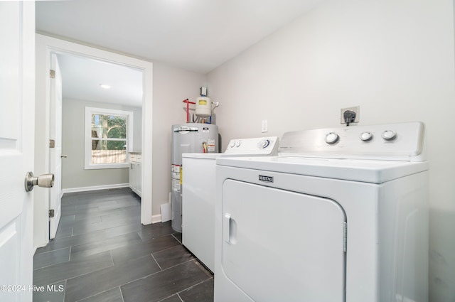 washroom featuring washer and dryer and water heater