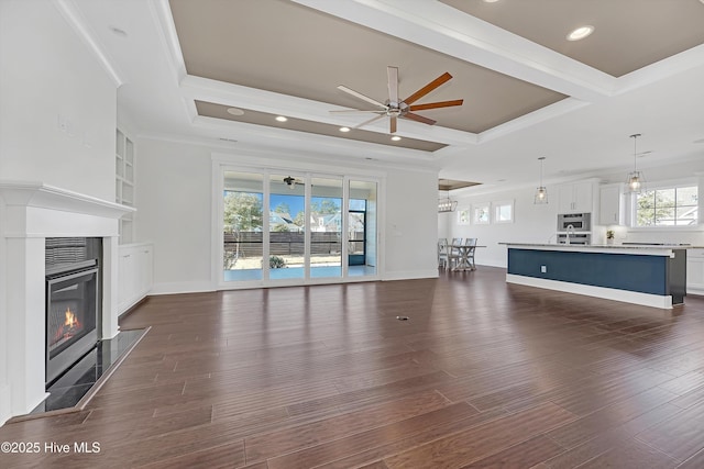 4450 Old Towne St, Wilmington, NC 28412 - unfurnished living room with ceiling fan, crown molding, a glass covered fireplace, recessed lighting, and coffered ceiling