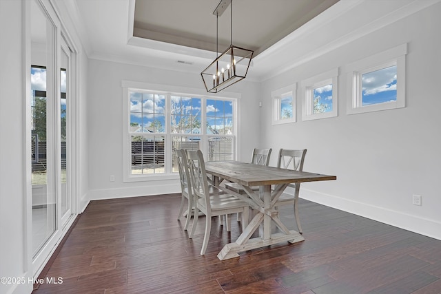 4450 Old Towne St, Wilmington, NC 28412 - dining space with a raised ceiling, a chandelier, baseboards, and dark wood-style floors