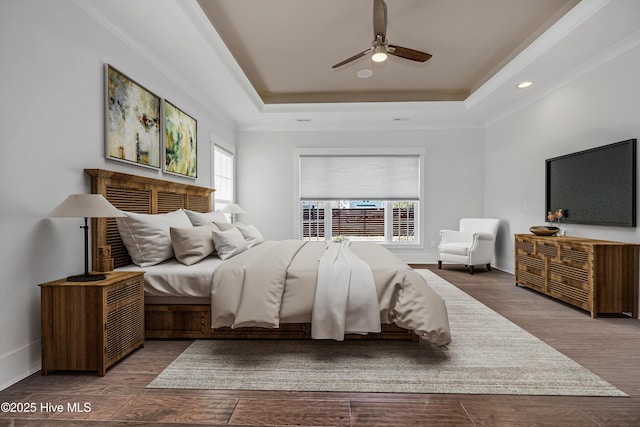 4450 Old Towne St, Wilmington, NC 28412 - bedroom featuring multiple windows, a tray ceiling, wood finished floors, a ceiling fan, and recessed lighting