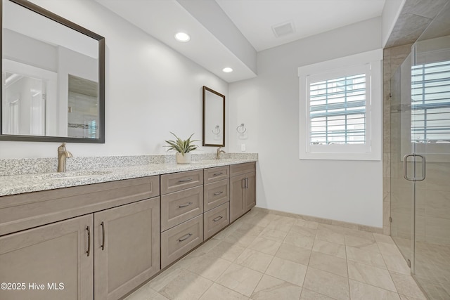 4450 Old Towne St, Wilmington, NC 28412 - bathroom featuring double vanity, a stall shower, baseboards, tile patterned floors, and recessed lighting