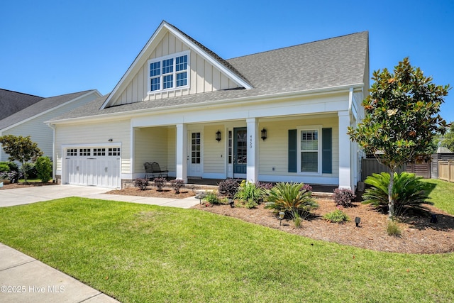 4450 Old Towne St, Wilmington, NC 28412 - view of front of property featuring board and batten siding, a porch, concrete driveway, a garage, and a shingled roof