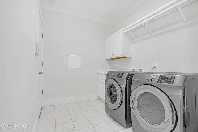 4450 Old Towne St, Wilmington, NC 28412 - laundry area featuring light marble finish floors, washer and dryer, cabinet space, and baseboards